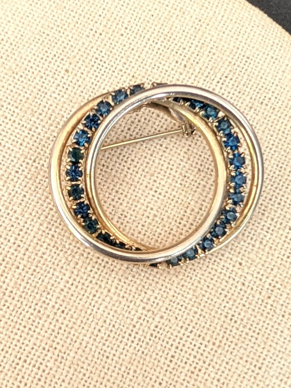 Vintage gold tone and faux sapphire brooch